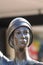 Bronze statue of lady waving close up of face
