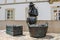 Bronze statue of old Portuguese farmer lady with her produce for sale, captured in front of the town`s traditional fish