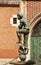 Bronze statue of a poor student near St Mary`s Basilica located in Krakow, Poland