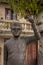 Bronze statue of Portuguese musician artist Zeca Afonso with a carnation flower on the hand in Belmonte, Portugal