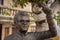 Bronze statue of Portuguese musician artist Zeca Afonso with a carnation flower on the hand in Belmonte, Portugal