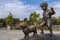 Bronze statue representing child and dog