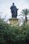 Bronze Statue of Seneca the Younger between jasmine garden