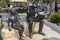 Bronze statue, soldier reading boy from book, in Torri del Benaco