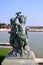 Bronze statue of three cherubs on the edge of a basin of the Bassin du Midi in the gardens of Versailles, in front of the west