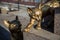 Bronze stone cats on granite stand