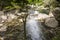 Brook flowing among rocks