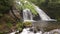 Brook flowing from waterfall