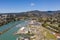 Brookings Oregon marina on sunny day with blue sky, aerial drone shot.