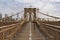Brooklyn Bridge and bikers in New York City, USA