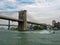 Brooklyn Bridge on East River with Harbor Patrol Police Boat