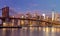 Brooklyn Bridge and Manhattan skyscrapers at sunrise, New York