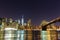 Brooklyn bridge and manhattan waterfront at night