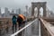 Brooklyn Bridge at rainy day in New York. USA