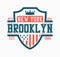 Brooklyn shield design for college t-shirt. New York stylish tee shirt print with shield, crown and USA flag. Typography graphics