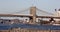 Brooklyn-side tower of Brooklyn Bridge, view across East River, Downton Heliport in the forefront, New York, NY