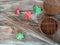 Broom, bamboo basket and leaves of maple on wood background