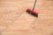 Broom Cleaning Dirt On Hardwood Floor