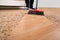 Broom Cleaning Dirt On Hardwood Floor