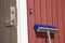 Broom leaning on a cottage wall