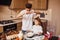 Brother with his little sister preparing food on kitchen and have fun