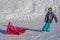 Brother pulling his sister kids toboggan sled snow. Little girl and boy enjoying sleigh ride. Child sledding. Children