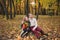 Brother and sister in autumn Park. Children laugh