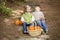 Brother and Sister Children Sitting on Wood Steps with Pumpkins