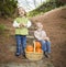 Brother and Sister Children on Wood Steps with Pumpkins Singing