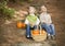 Brother and Sister Children on Wood Steps with Pumpkins Singing