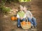 Brother and Sister Children on Wood Steps with Pumpkins Whispering