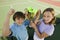 Brother and Sister holding up Tennis Trophy