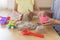 Brother and sister play together with kinetic sand and sand forms at home.
