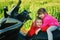 Brother and sister playing on a motorcycle