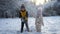 Brother and sister playing in Snow