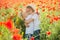 Brother and sister in poppy field