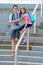 Brother and sister simling on the grand staircase during the sum