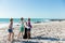 Brother and sisters having fun at the beach