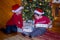 Brothers examine gifts under the tree