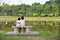 Brothers hugging each other facing a lake