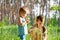 Brothers outdoors in dandelions