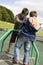 brothers on playground, climbing a roped frame