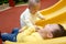 Brothers on the playground slide