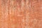 Brown adobe clay wall texture background.