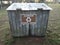 brown aluminum plastic glass recycle sign on wood shed