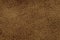 Brown background from a soft upholstery textile material, closeup