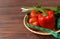 Brown background, tomatoes and red pepper with centimeter diet f