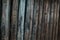 Brown background with wooden vertical boards with metal nails, free space for text. Vertical Wood Texture