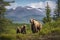 Brown Bear and Two Cubs against a Forest and Mountain Backdrop at Katmai National Park, Alaska