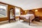 Brown bedroom with carved wood furniture